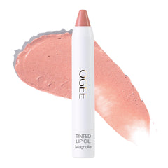 Ogee Magnolia tinted lip oil bottle close-up shows sheer pink glow for lips