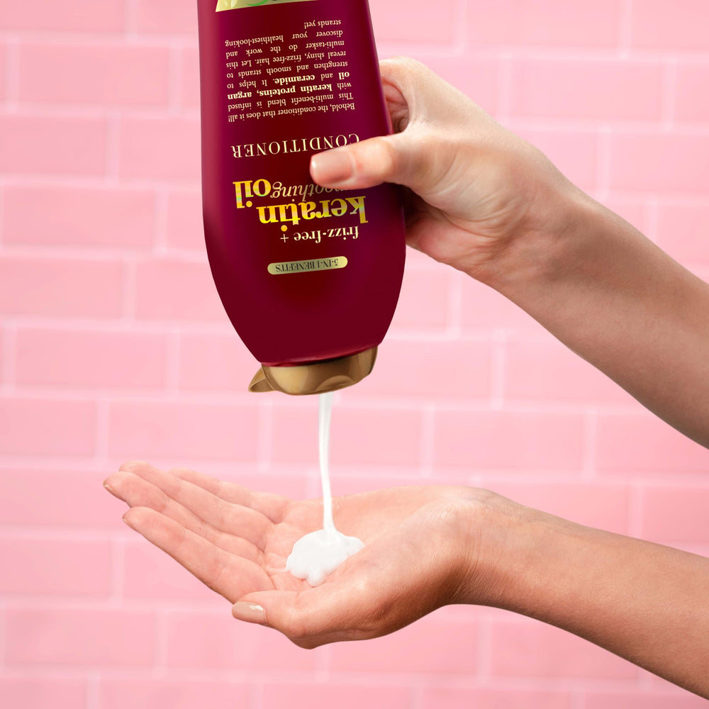 OGX conditioner on wet hair demonstrates detangling and smooth styling.