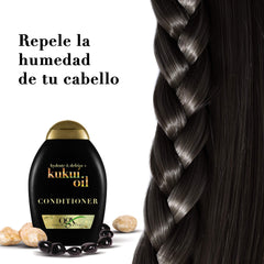 OGX Kukui Oil Conditioner hair strands with a smooth, shiny finish after use.