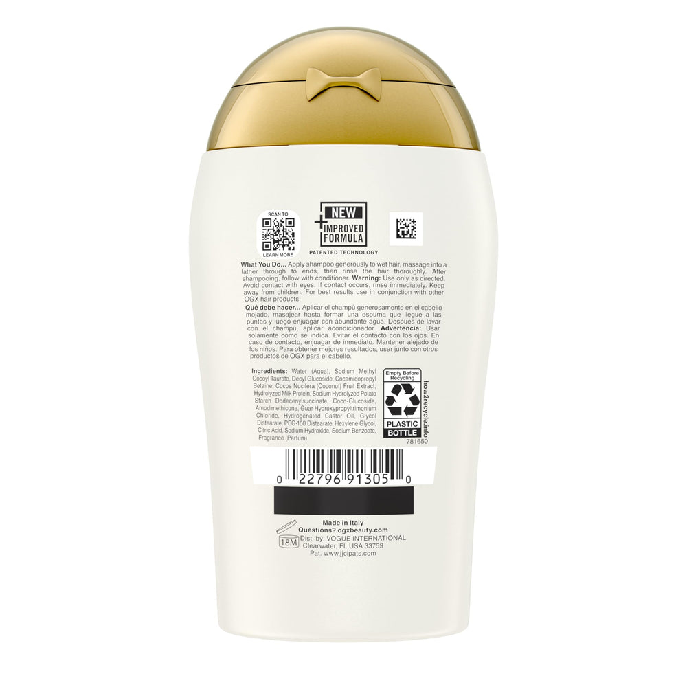 OGX Nourishing Coconut Milk Shampoo bottle reflected on glass signals premium branding.