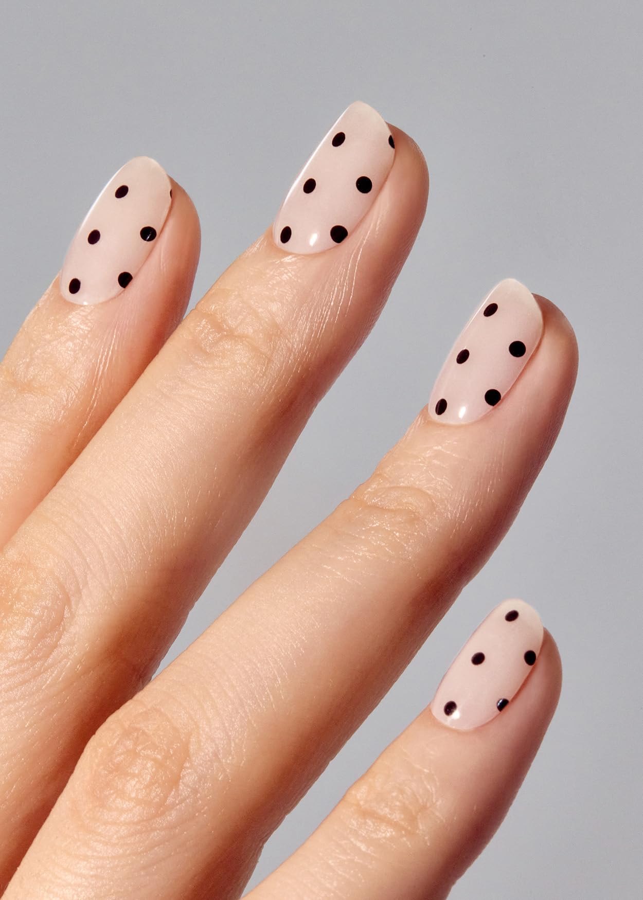 Ohora N Polka Noir strips applied on nails for quick DIY manicure.