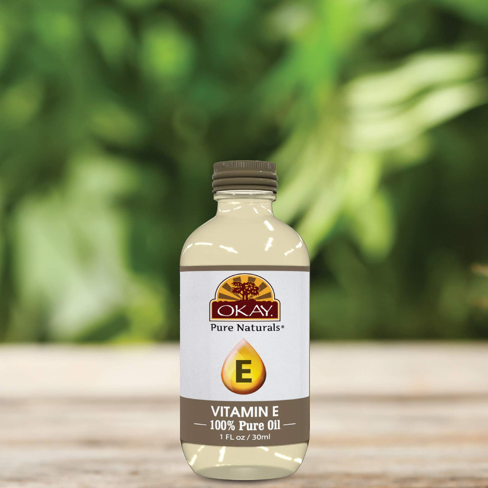 OKAY Vitamin E Oil texture close-up shows smooth, easy-massage consistency.