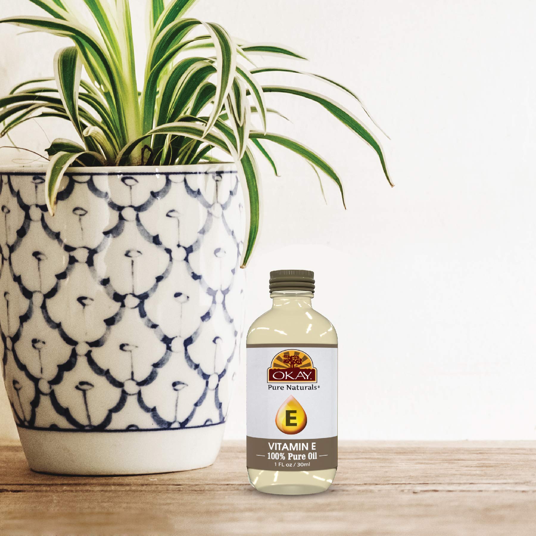 OKAY Vitamin E Oil packaging shows natural ingredients and a convenient 1 fl oz bottle.