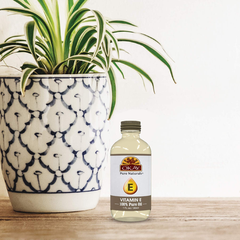 OKAY Vitamin E Oil packaging shows natural ingredients and a convenient 1 fl oz bottle.