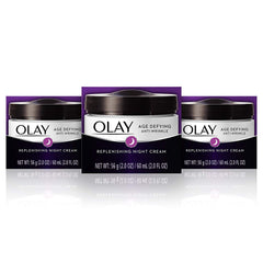 Olay Age Defying Night Cream bottle pump showing hydrated skin by morning