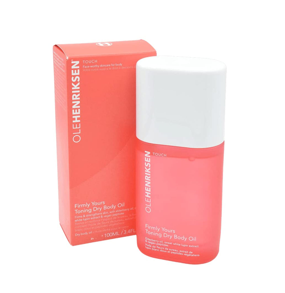 Applying Ole Henriksen Firmly Yours dry body oil for quick absorption.