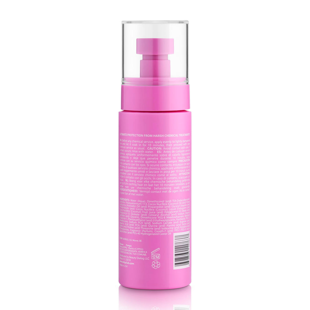 Oli G Bond-Repair Spray dispensed onto damp hair for pre-chemical prep.