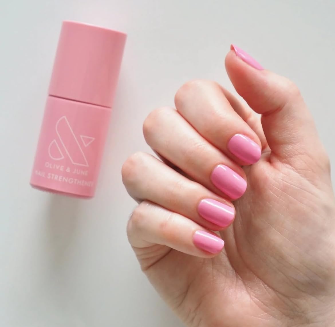 Olive & June Nail Strengthener packaging shown for convenient at home use.