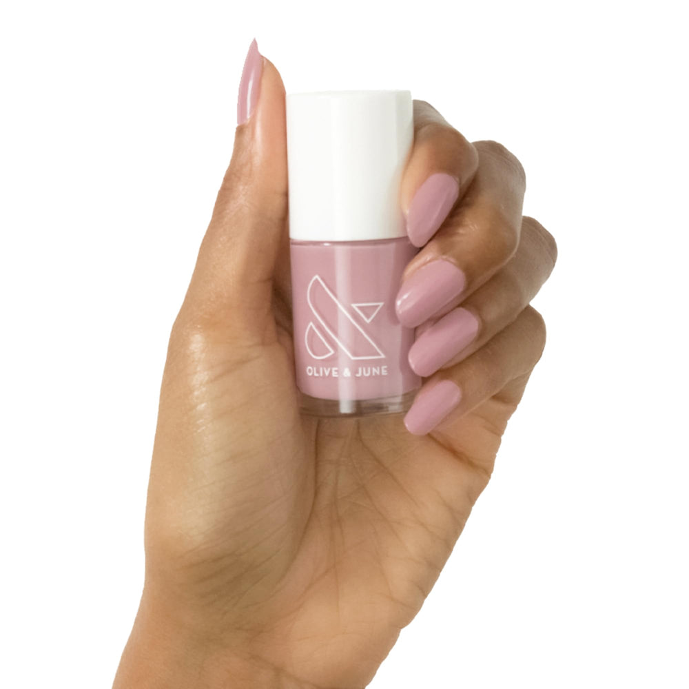 Olive & June World Lit Mauve bottle close-up showing rich gel-like shade