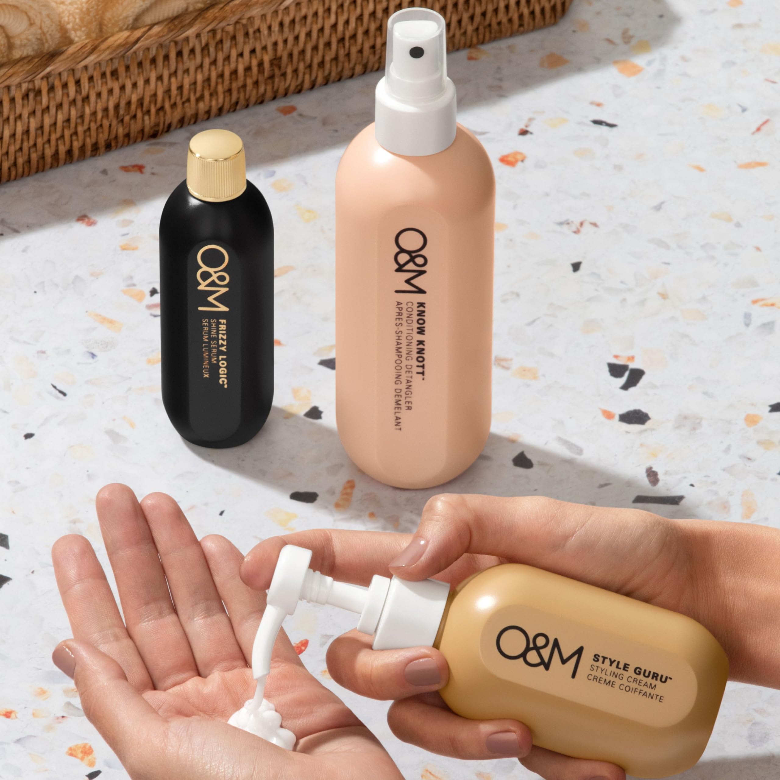 O&M Frizzy Logic Serum smoothing frizz on strands