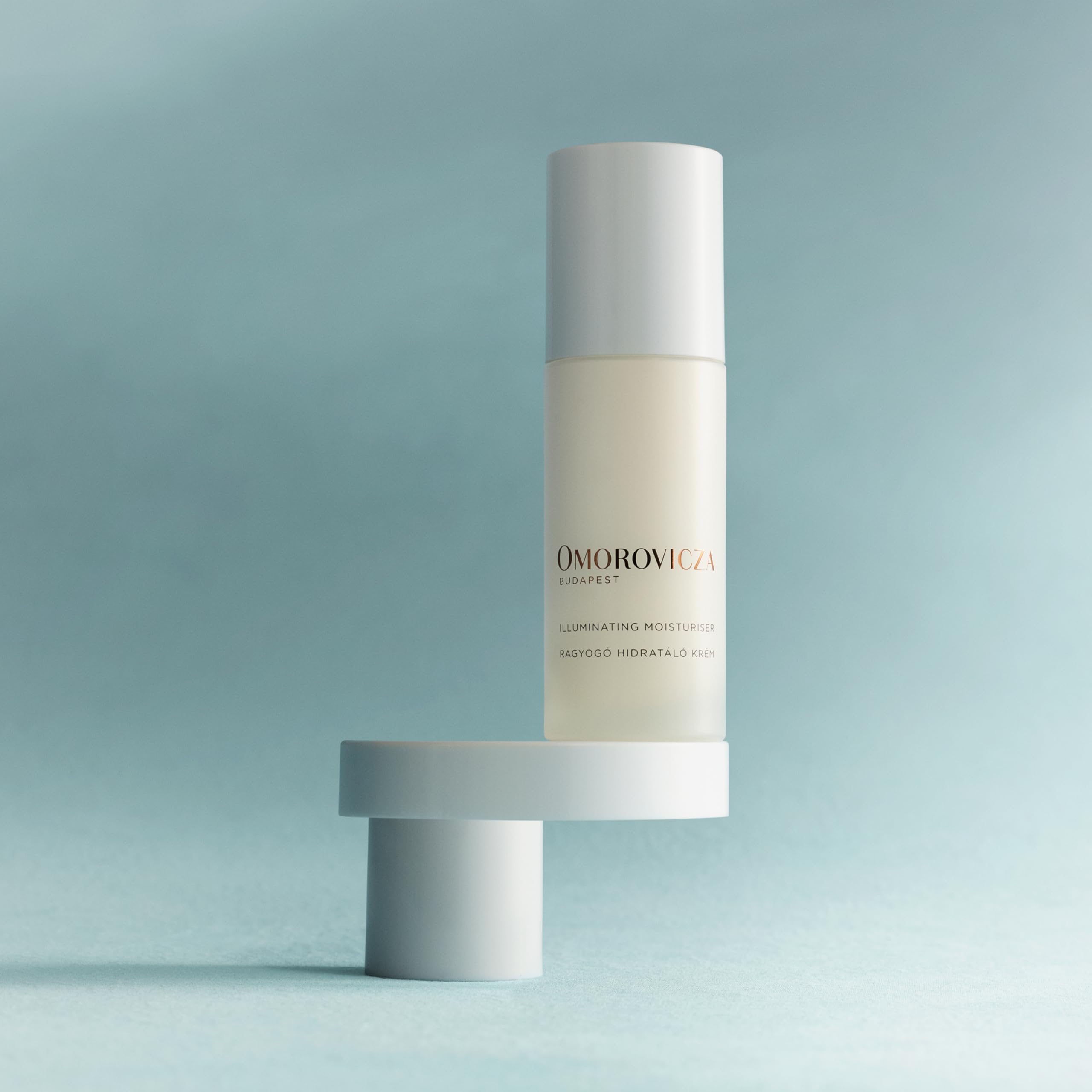 Omorovicza Illuminating Moisturizer face application shows even, dewy finish