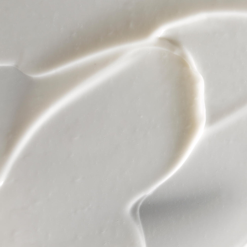 Omorovicza Illuminating Moisturizer texture closeup; a light, nourishing cream for dry skin
