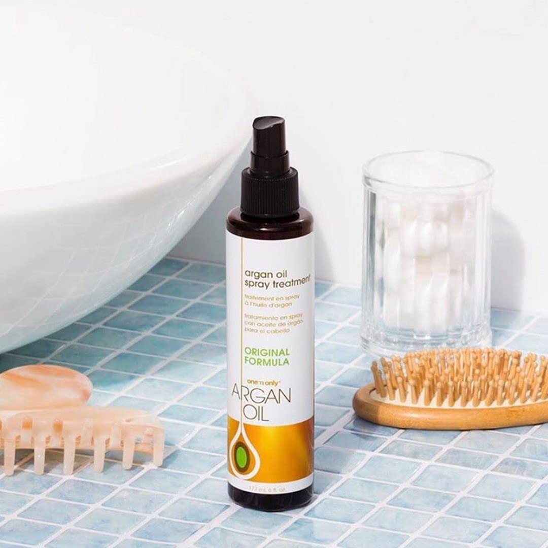 Damp hair application seals moisture with One 'N Only Argan Oil Spray Treatment.