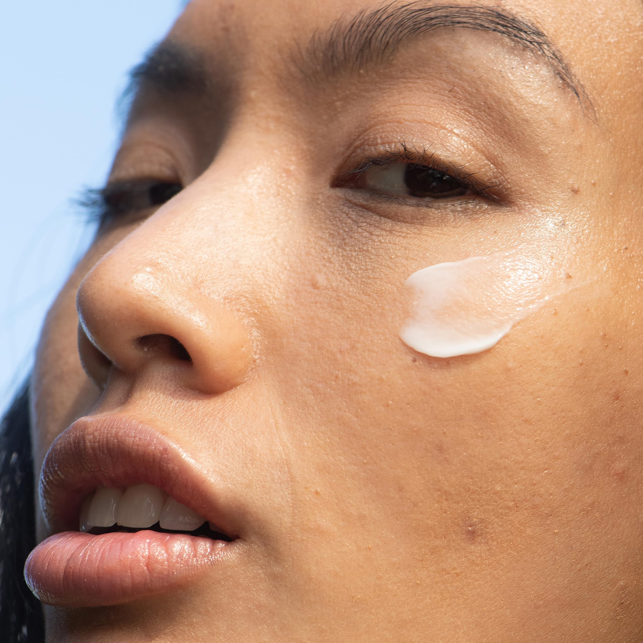 Onekind Mega Multitasker morning routine scene with moisturizer among skincare products.