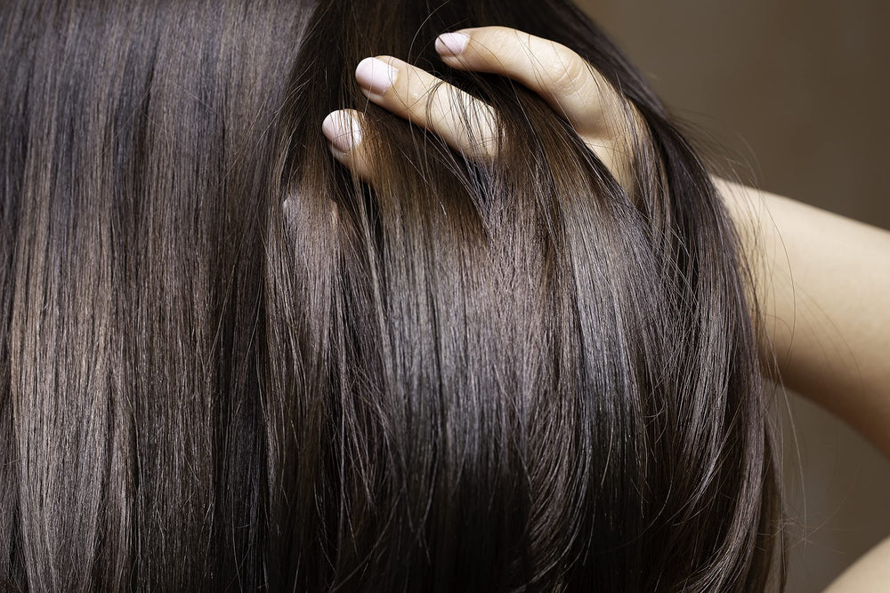 OPO Rice Water Mixture hair mist in use on damp hair