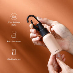 Orbitkey Clip-on bottle attached to a belt loop for hands-free carry.