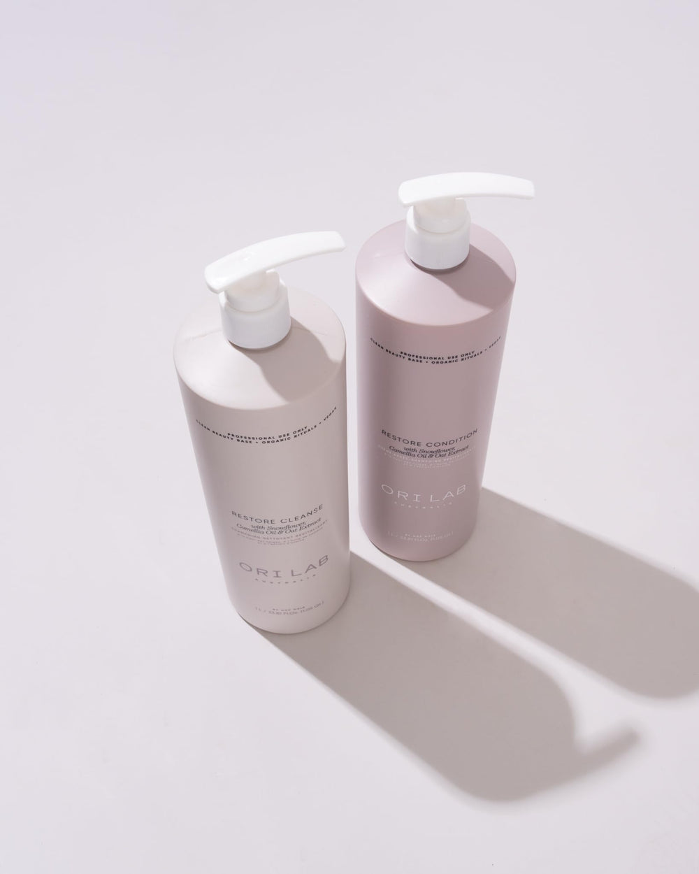 ORI LAB Restore Cleanse bottle in a bathroom scene, signaling a calm routine for color-treated hair.