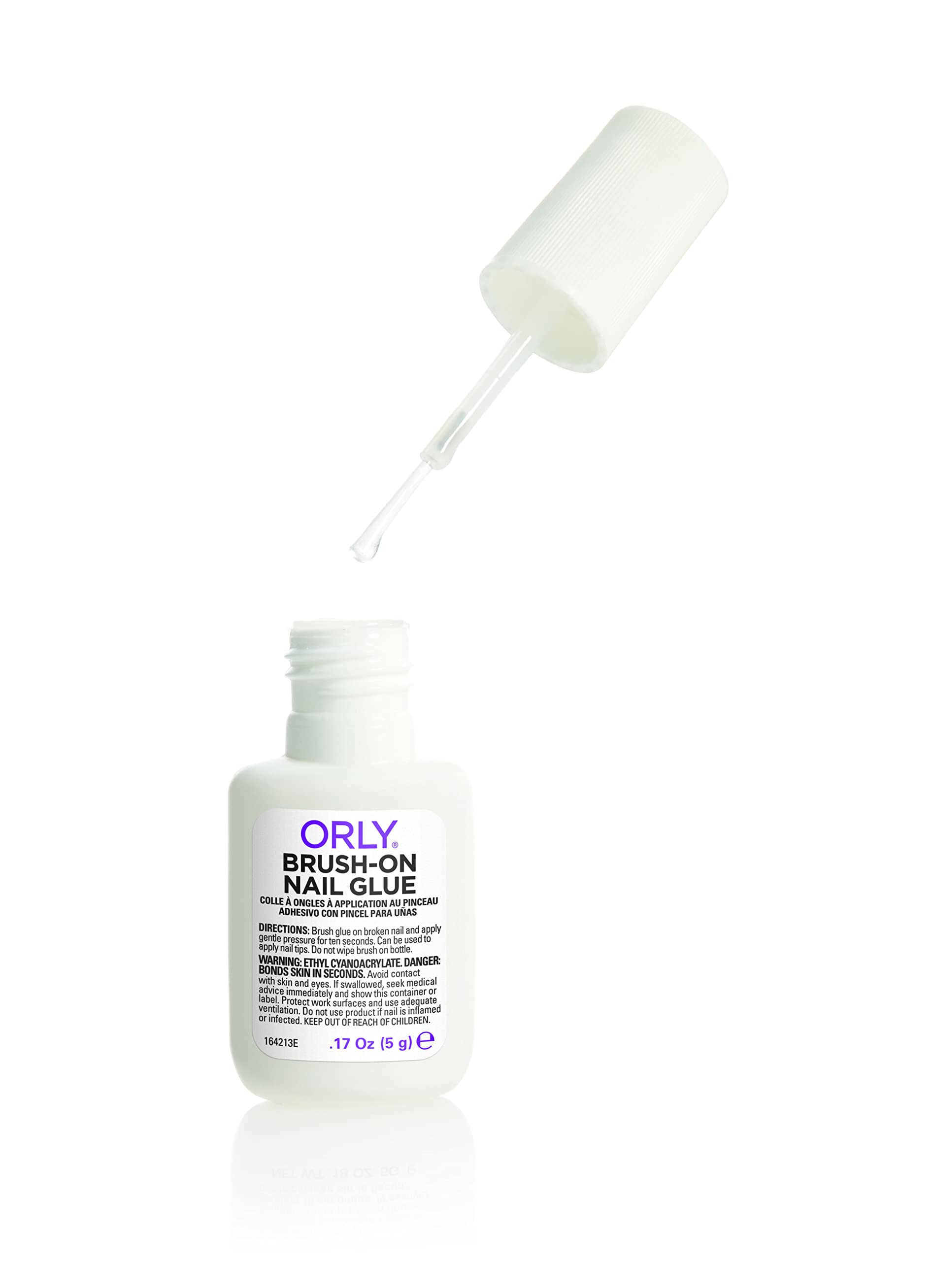 Orly Brush-On Nail Glue in use for precise nail repair and artificial nail application.