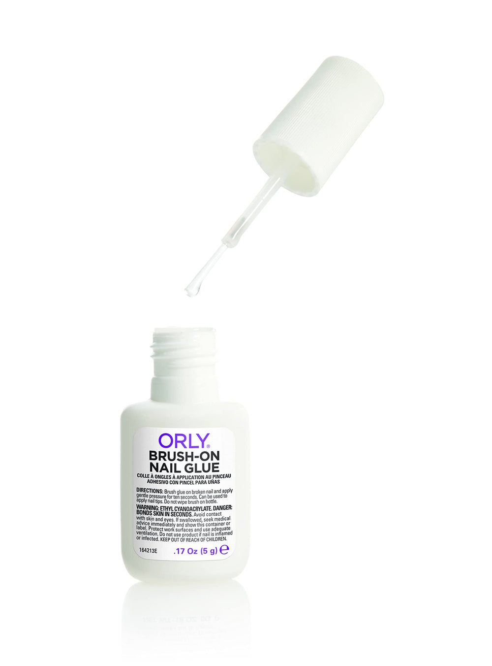Orly Brush-On Nail Glue in use for precise nail repair and artificial nail application.