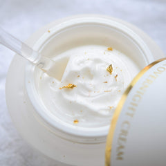 Orogold night cream texture swatch showing velvety finish for easy absorption.