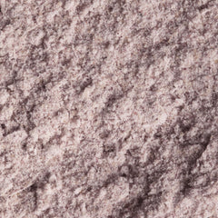 Pour action of OSEA Gigartina Therapy Bath Soak shows fizzing minerals for a relaxing ritual.