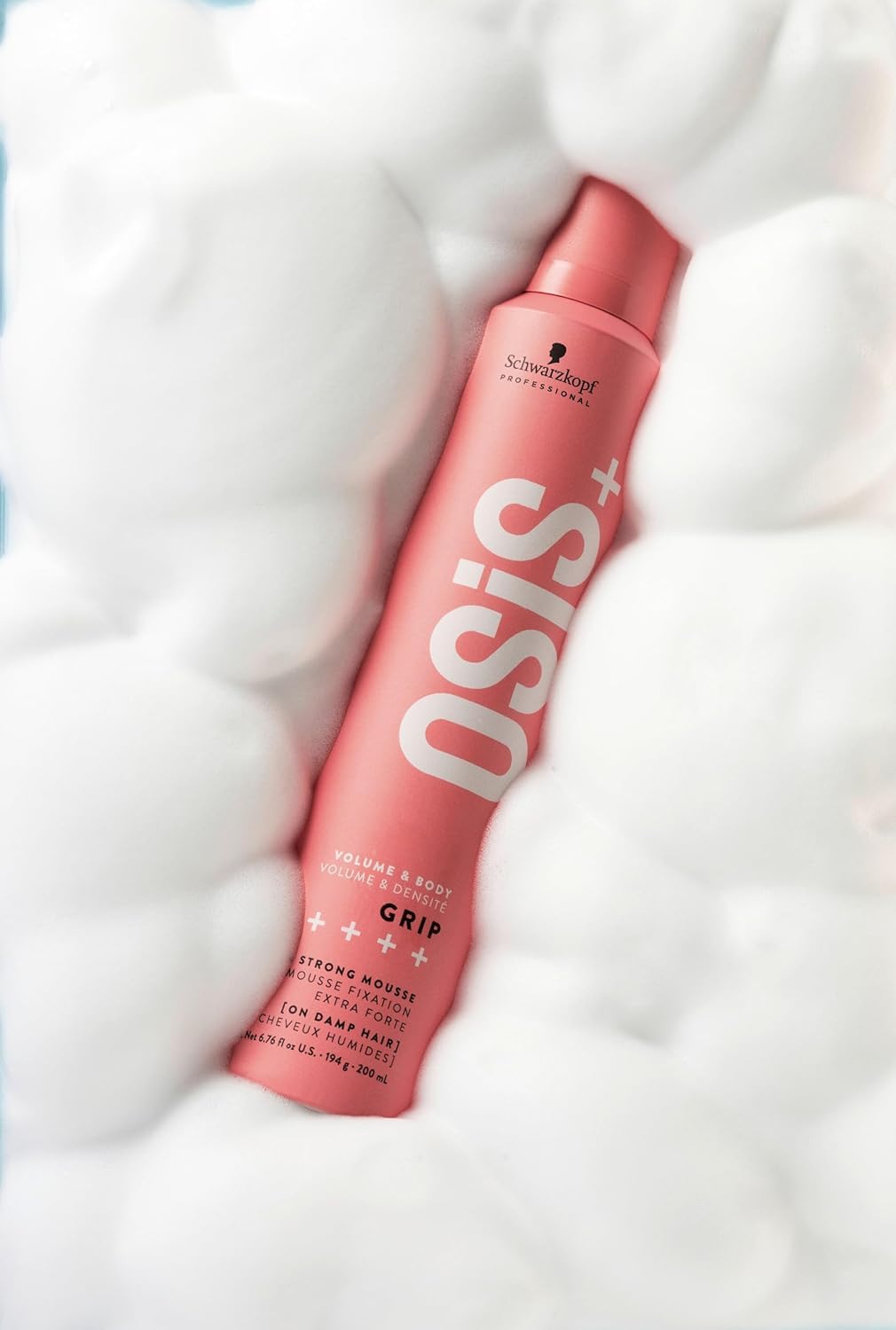OSiS+ Grip Extreme Hold Mousse round brush drying for lift.