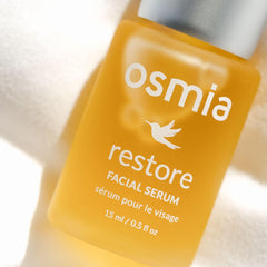 Osmia Natural Restore Serum jojoba oil bottle demonstrates balanced moisture for dry skin.