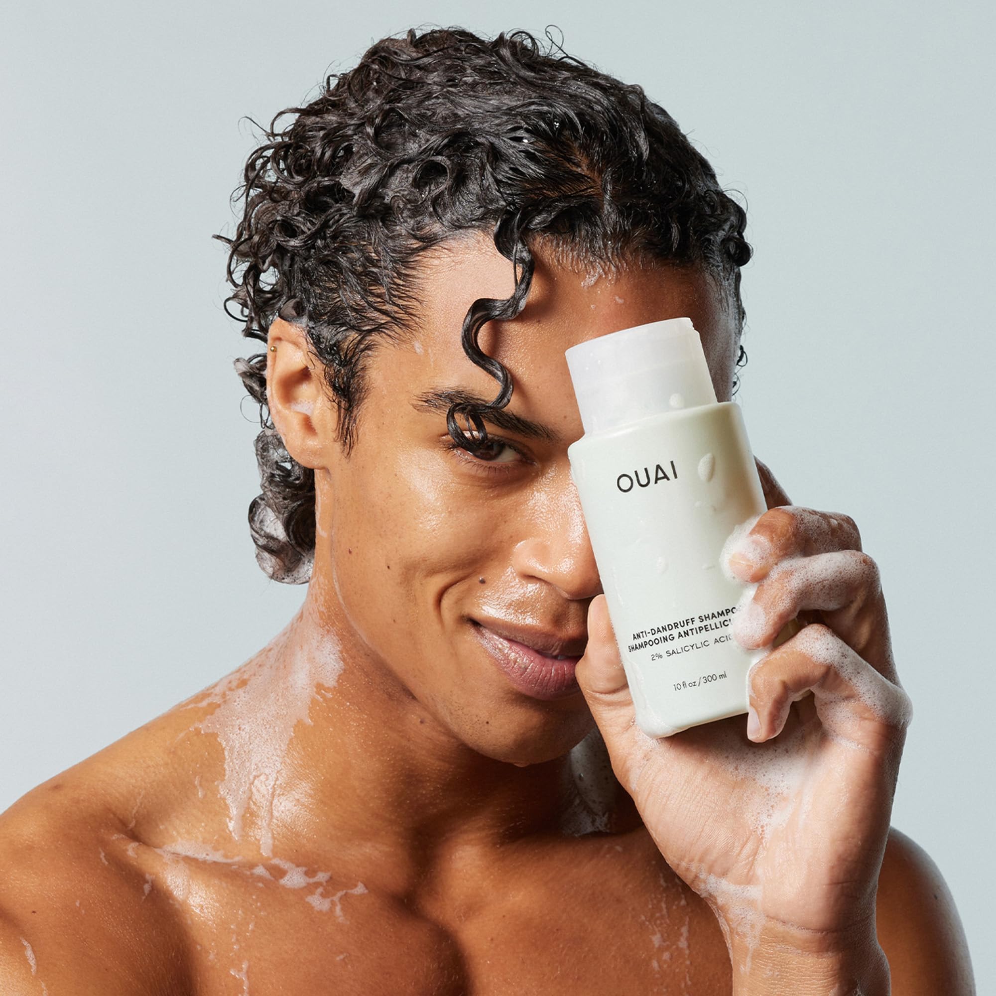 OUAI dandruff solution application close-up for daily use