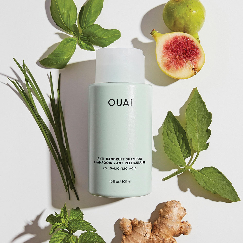 OUAI scalp-care routine laid out beside bottle for quick, refreshing wash