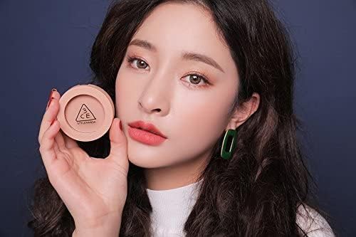 OULANAO peach-toned blush adds soft glow and natural flush.