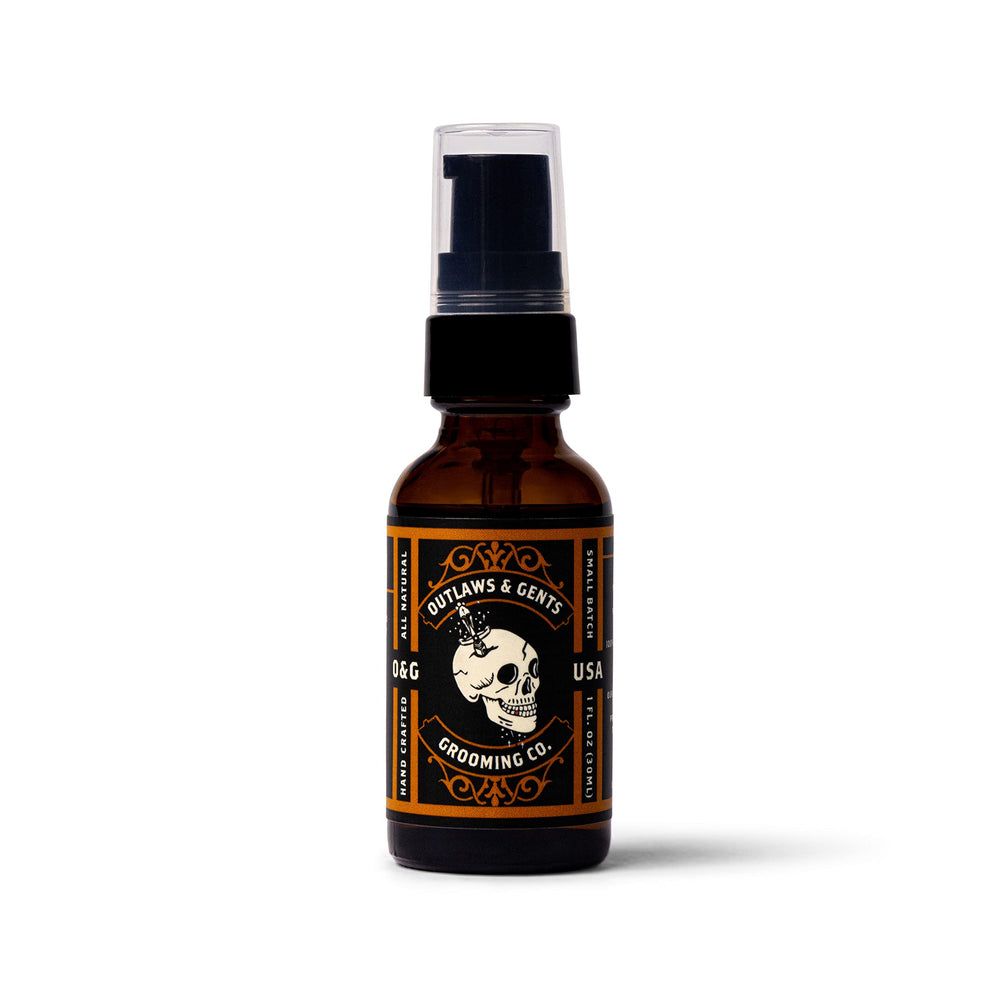Outlaws & Gents Grooming Co grooming oil drops on beard: quick absorption and skin nourishment.