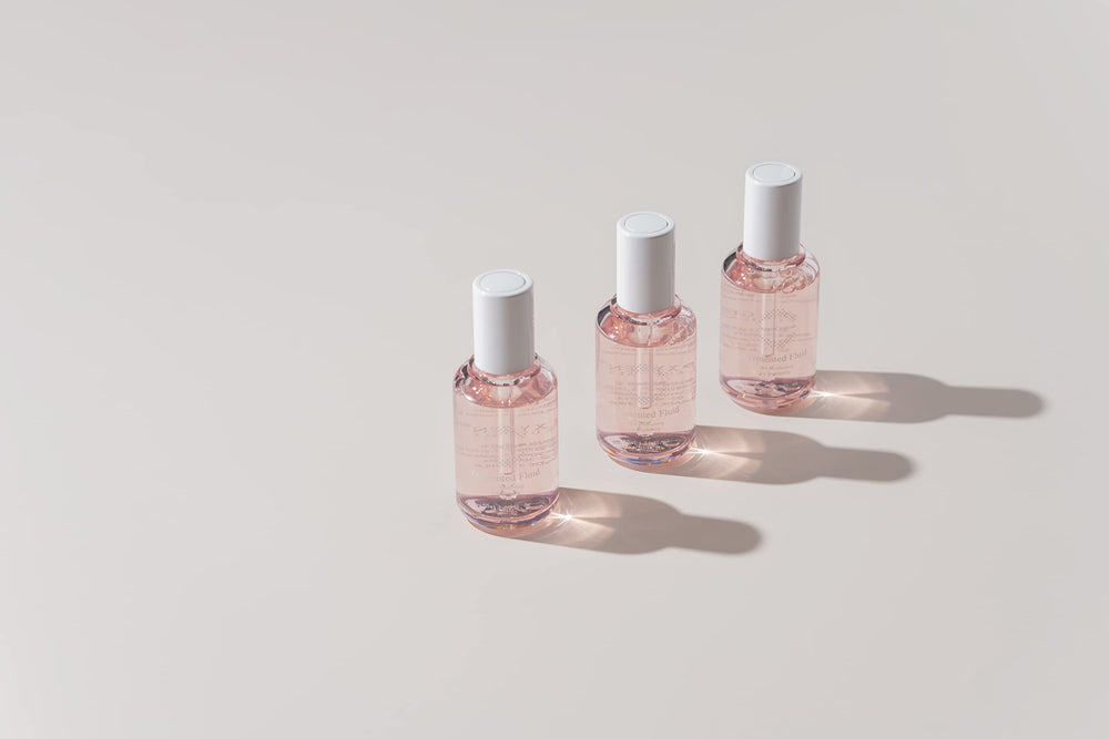 OxygenCeuticals Fermented Fluid with arbutin and niacinamide targets even tone.