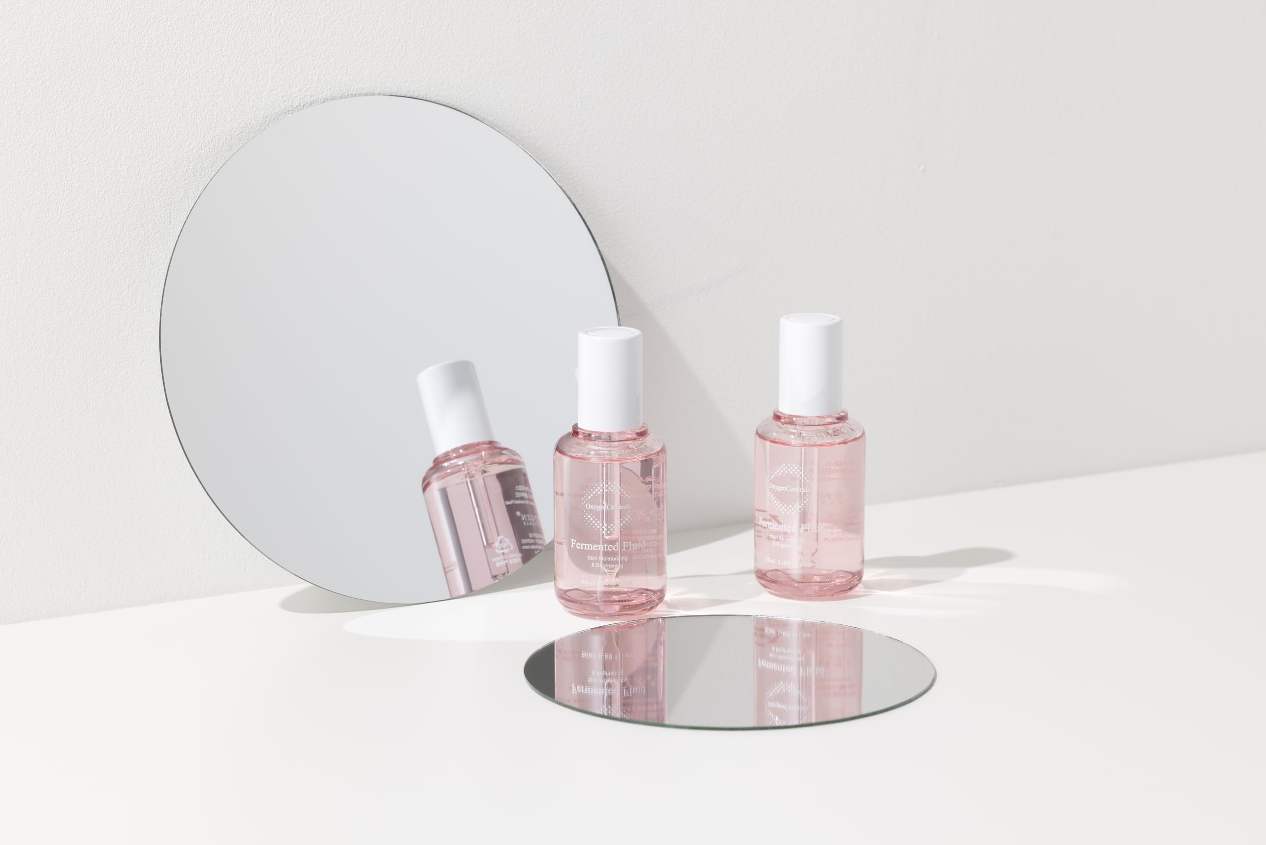 OxygenCeuticals Fermented Fluid texture close-up highlights a lightweight, non-sticky feel.