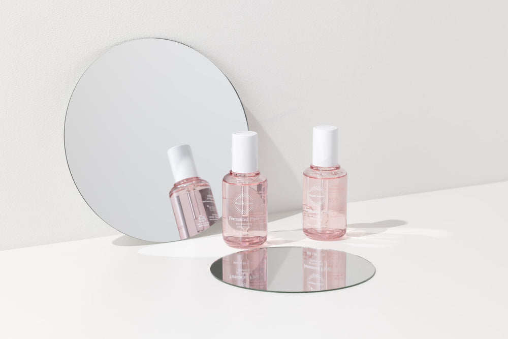 OxygenCeuticals Fermented Fluid texture close-up highlights a lightweight, non-sticky feel.