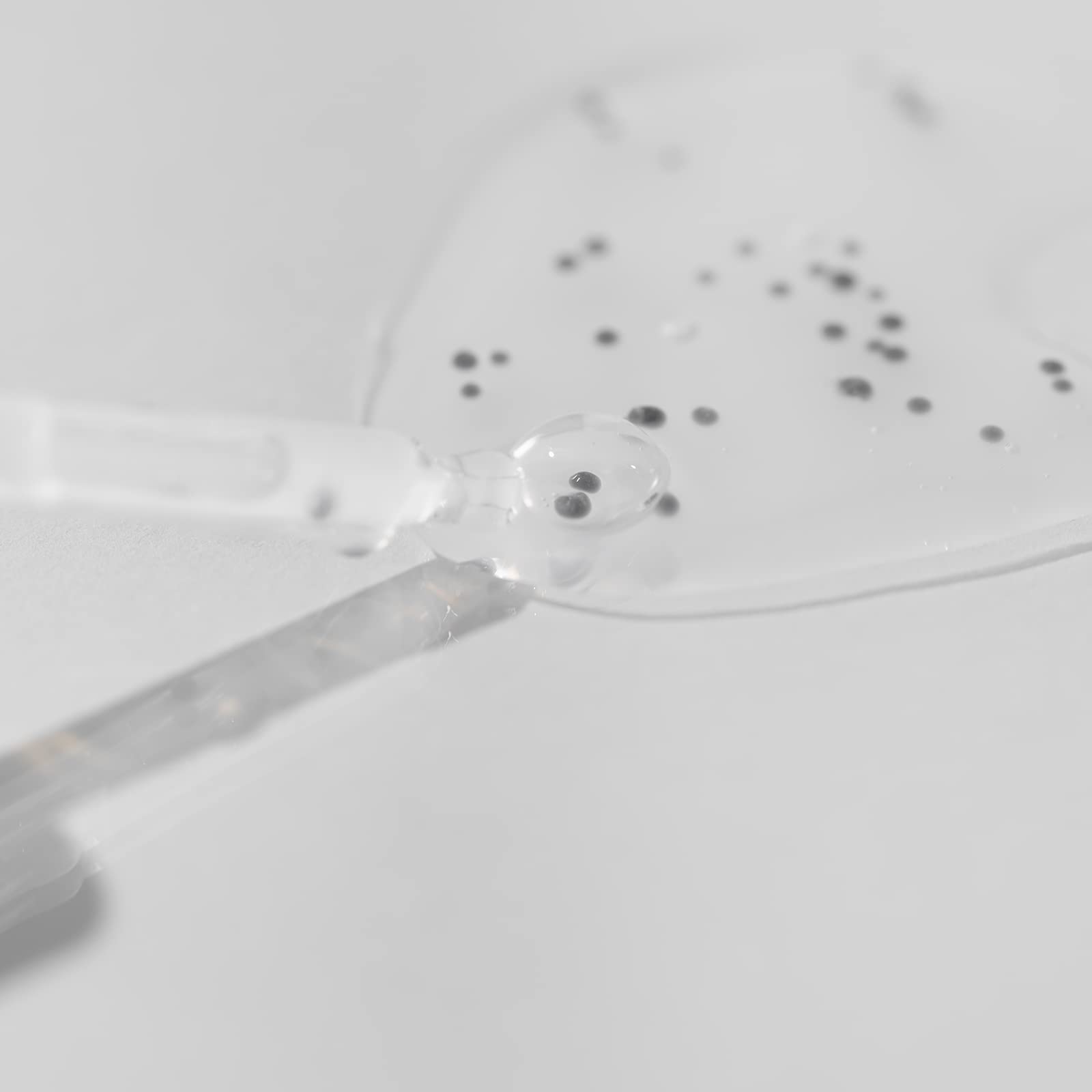 OxygenCeuticals Caviar Protein Fluid being dispensed for smooth application.