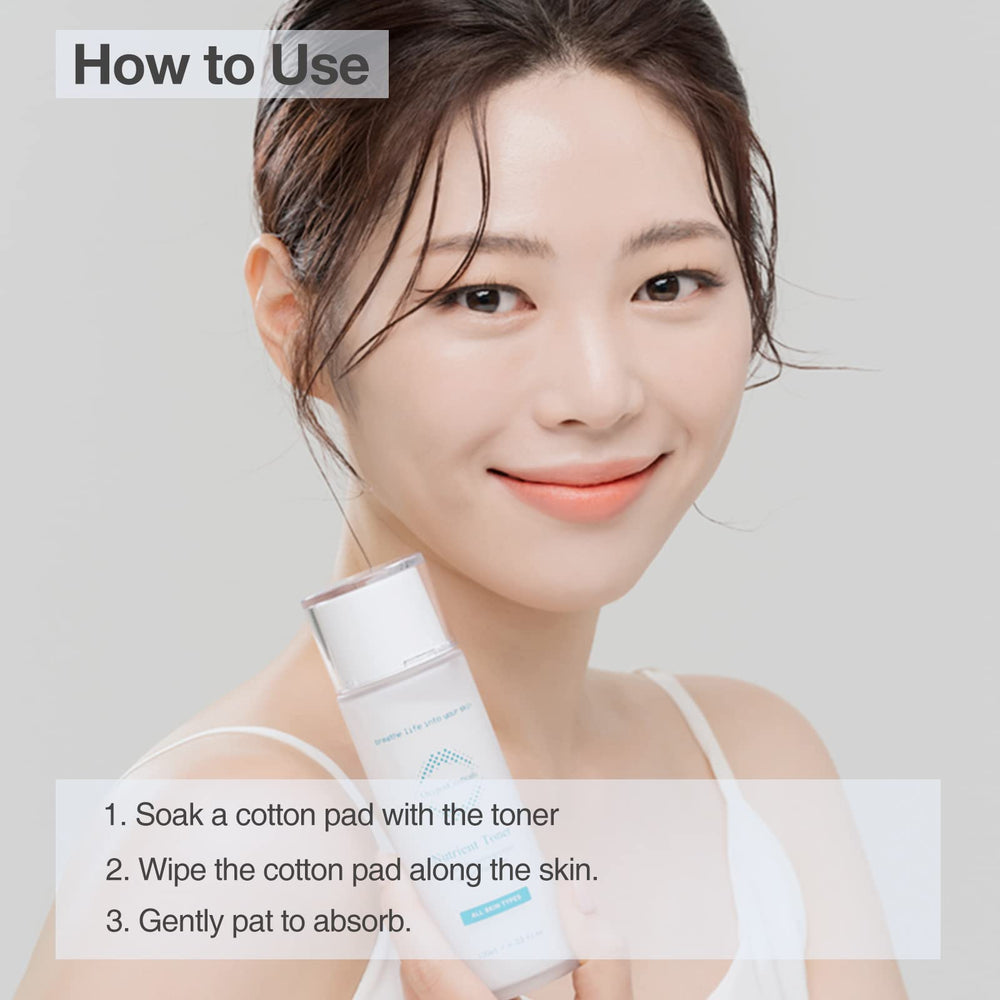 Cotton pad with OxygenCeuticals Nutrient Toner for even distribution