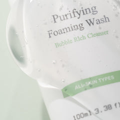 OxygenCeuticals Purifying Foaming Wash pump bottle beside sink, gentle non-drying formula