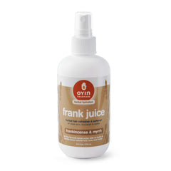 Oyin Handmade Frank Juice bottle close-up for scalp conditioning and moisture.