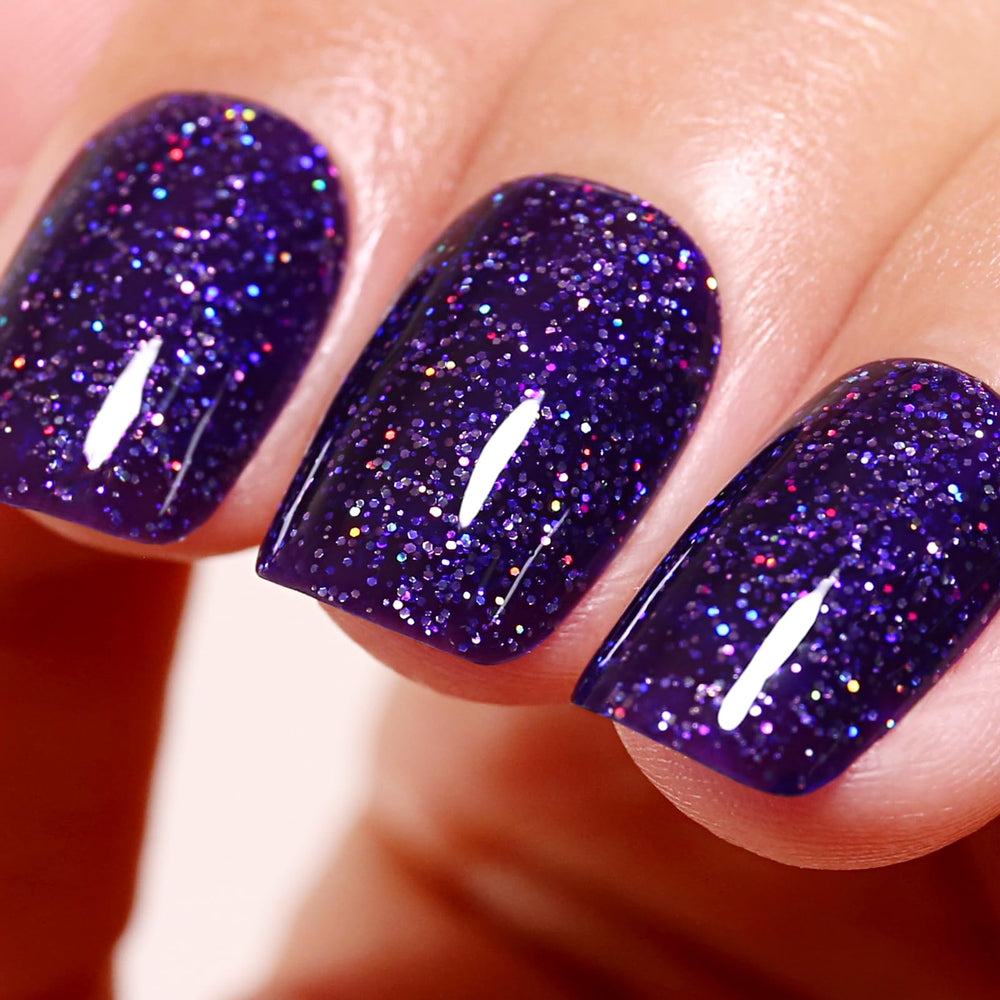 Ozzeal deep purple iridescent glitter nail polish bottle showing sparkling color