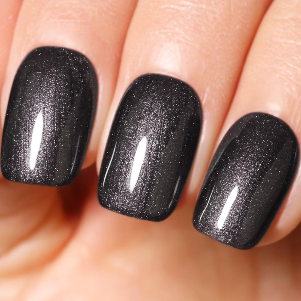Ozzeal Pearl Gel Polish black glitter bottle close up for elegant long-lasting nail sparkle.