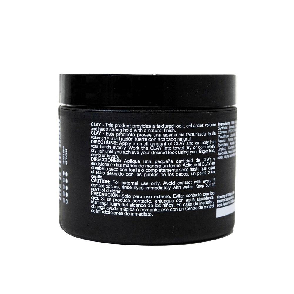 Pacinos clay paste in hands, ready for shaping textured styles.
