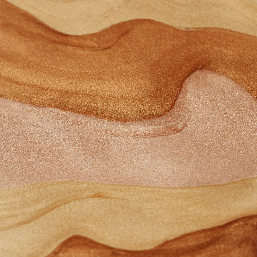 Swirl of champagne-colored glow on skin during morning light.