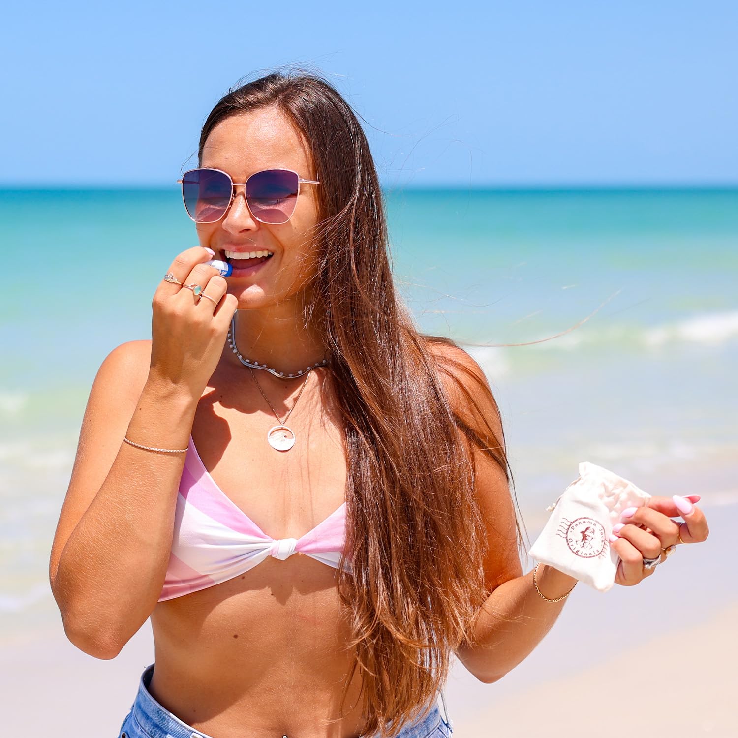 Panama Jack Sunscreen Lip Balm bottle with adjustable knob enables easy reapplication.