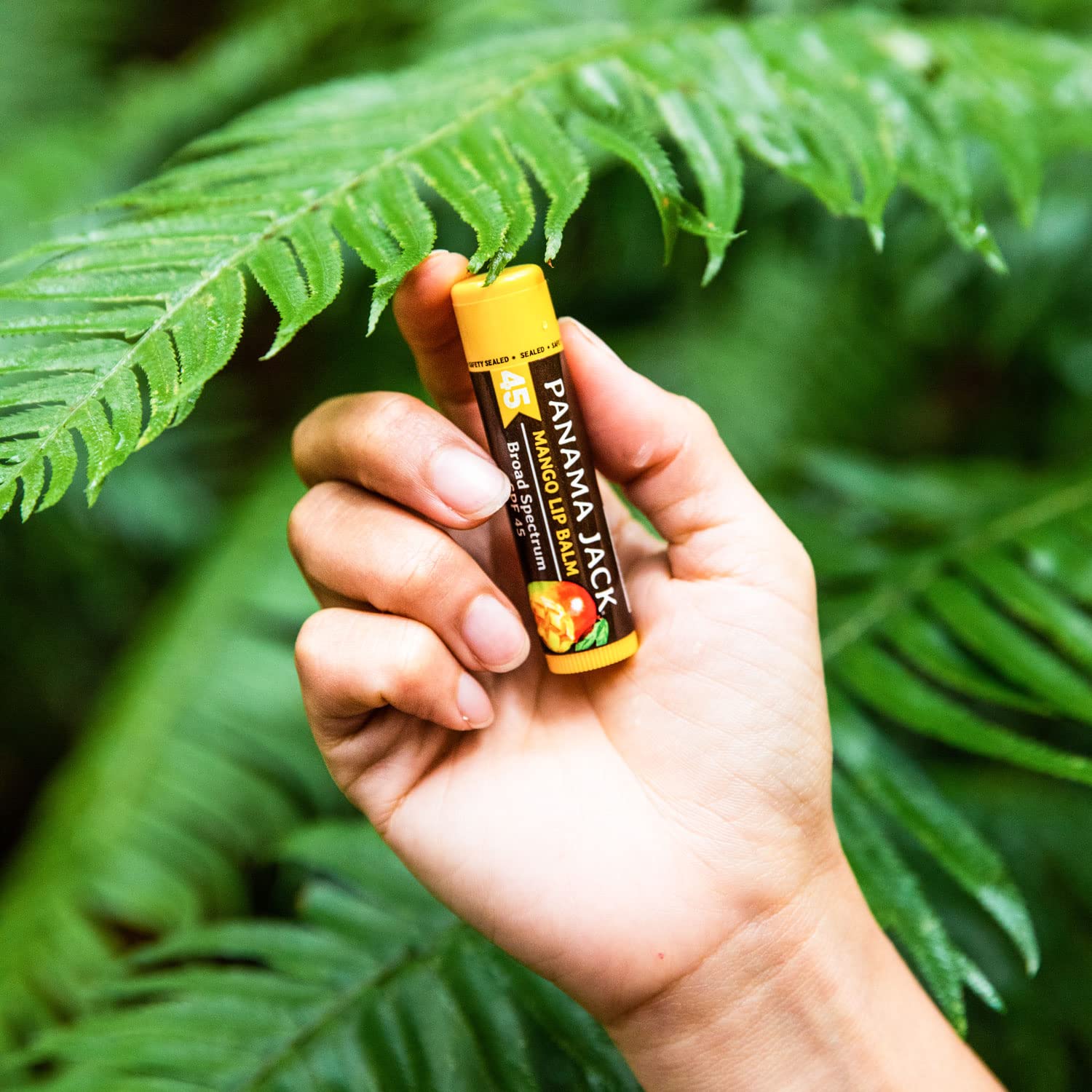 Panama Jack SPF 45 lip balm mango in a handheld dispenser