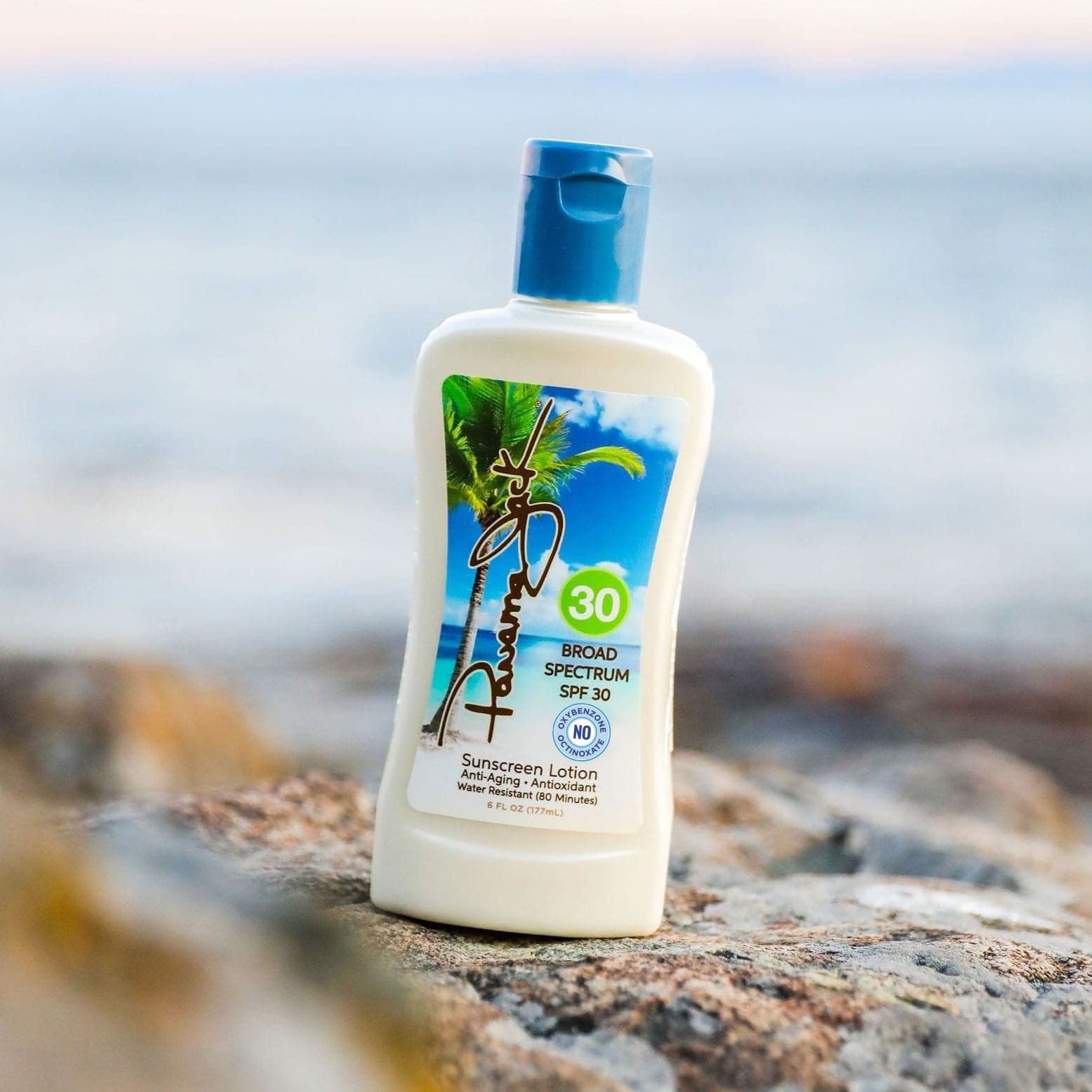 Panama Jack Sunscreen SPF 30 tropical fragrance swirls for vacation vibes.