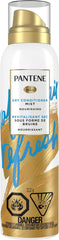 Pantene Dry Conditioner Mist bottle applying instant hydration to dry hair.