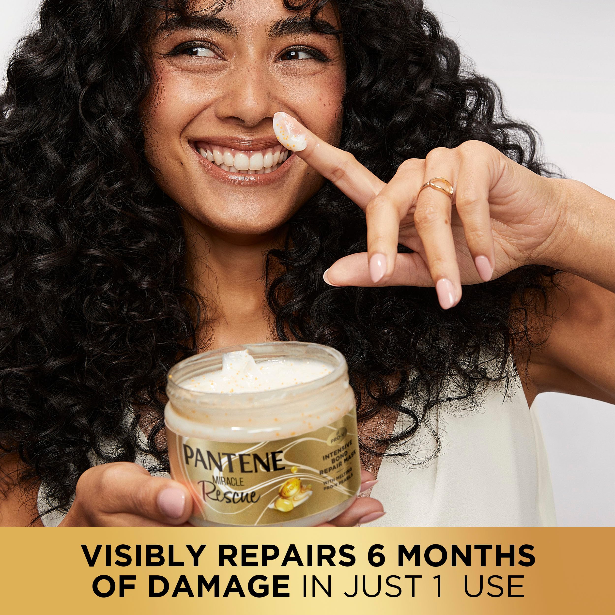 Pantene hair being rinsed as pearls dissolve away.