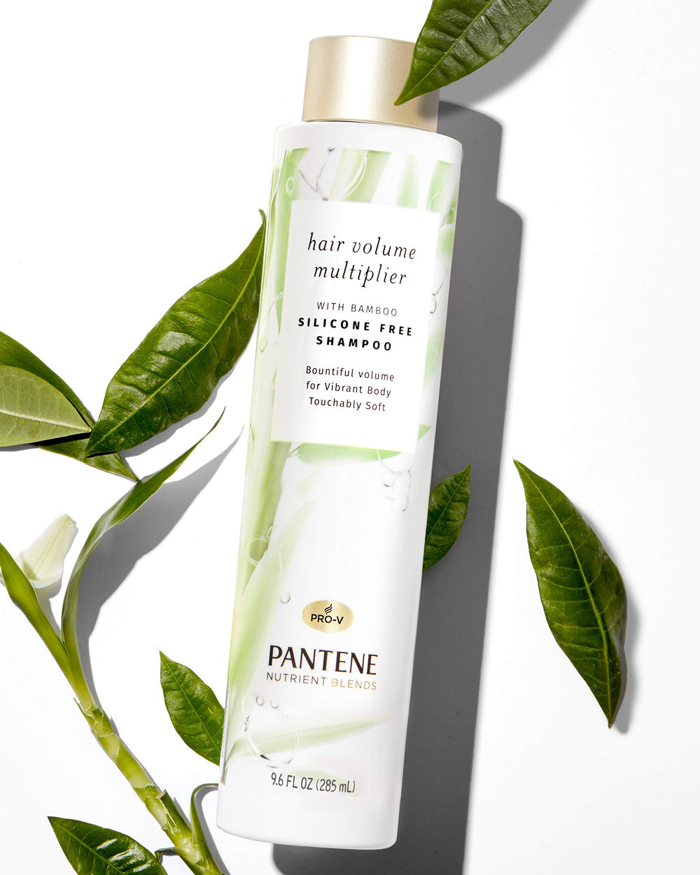 Pantene bamboo shampoo texture showing airy foam on hands.