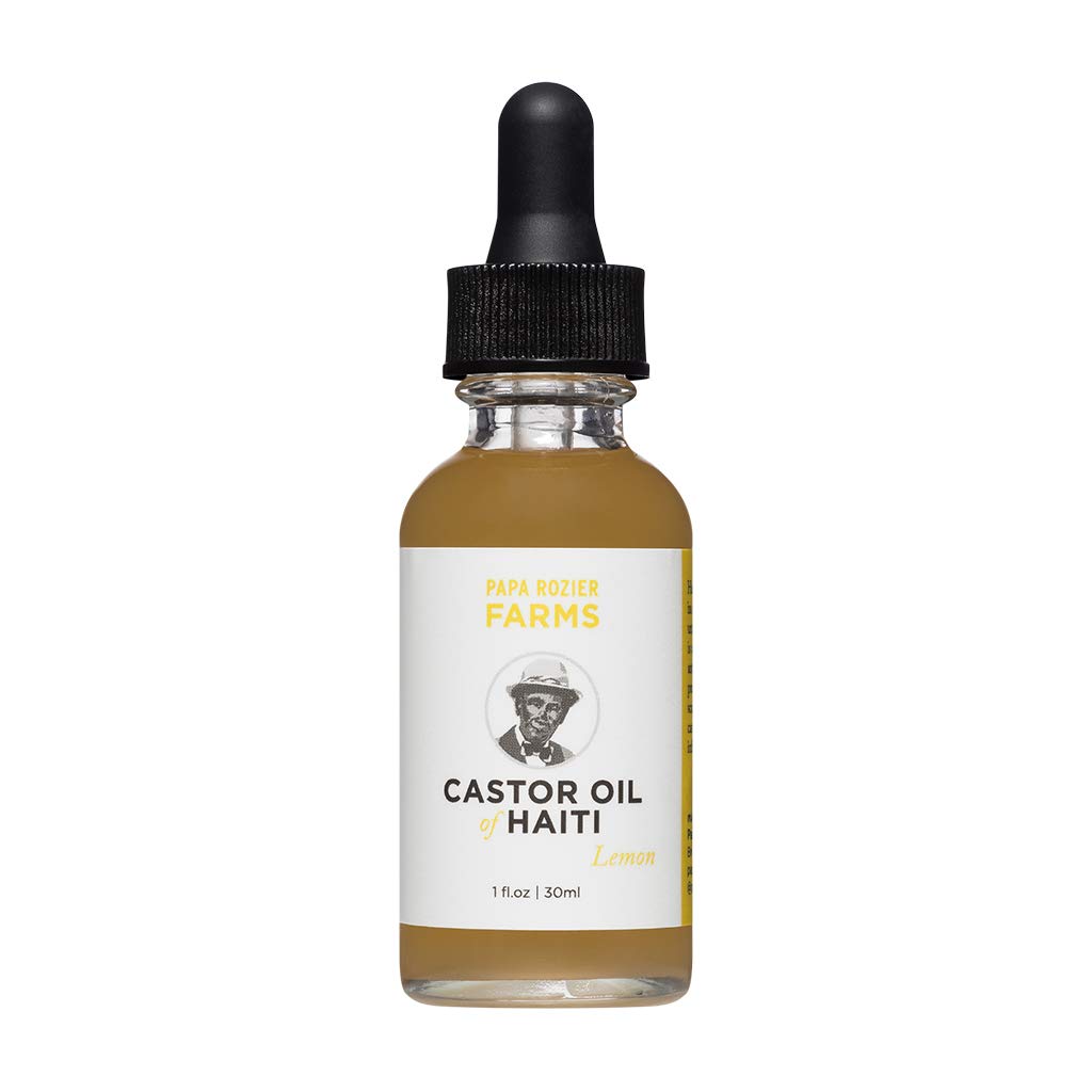 Papa Rozier Farms Lemon Castor Oil application on hair for nourishment and conditioning.