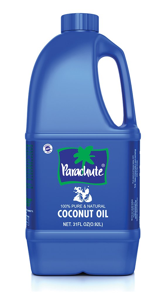 Parachute coconut oil bottle pour shows pure, versatile use in cooking and skin care.